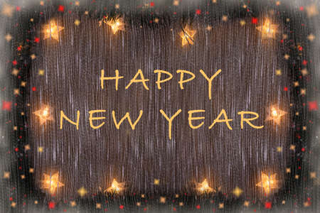New Years background with a glowing garland of stars, fir branches, lights with the inscription of Happy new year .の写真素材