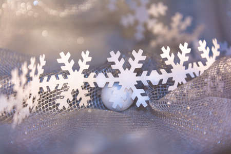 white paper cut out of snowflakes and white ornament ball for decorationの写真素材