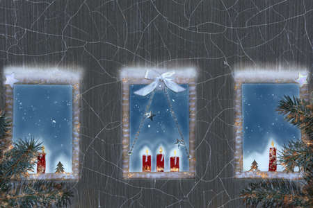 Christmas decorated windows of a cozy home. Background cracked dark plaster.の写真素材