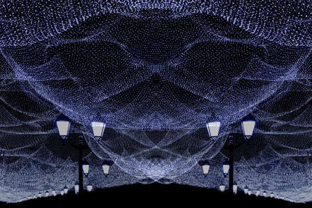 Christmas illumination of the night city. White lights, lights on  the street.の写真素材