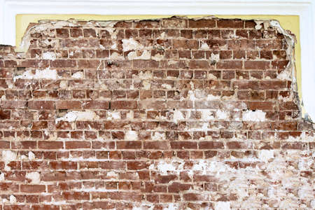 Old red brick laying on the background of a restored wall.の写真素材