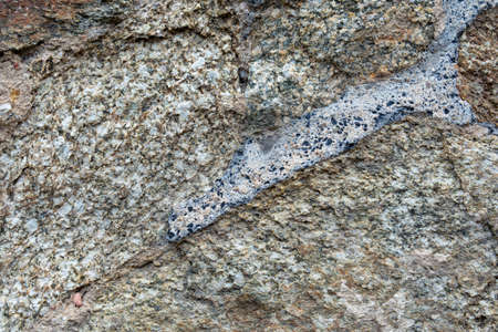 Stone wall with different building materials and different texturesの写真素材