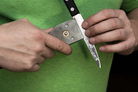 Installing the knife holder for sharpening the knife itself.の写真素材