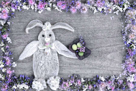 The composition of the rabbit from the leaves of the flower Stakhis and the frame of flowers Spirea and Veronica.の写真素材