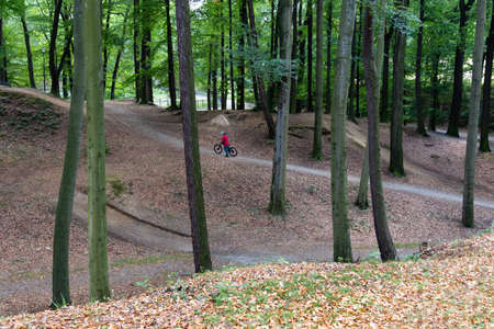 Cyclist preparing to jump on the bike in the park.の写真素材