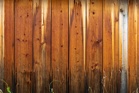 Wooden wall with a protective layer of brown paintの写真素材