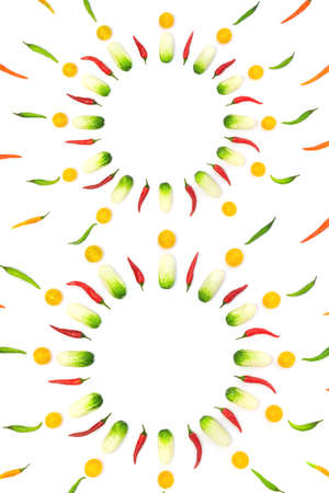 Top view flat lay over cucumbers, cherry tomatoes and peppers on a white digit eight background with copy space. Food template design menu background design with culinary ingredientsの写真素材