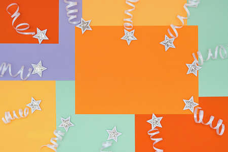 Bright background with a non-symmetrical geometric pattern in trendy colors with a composition of confetti and shiny white stars. Concept background, holidayの写真素材