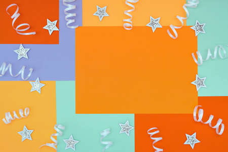 Bright background with a non-symmetrical geometric pattern in trendy colors with a composition of confetti and shiny white stars. Concept background, holidayの写真素材