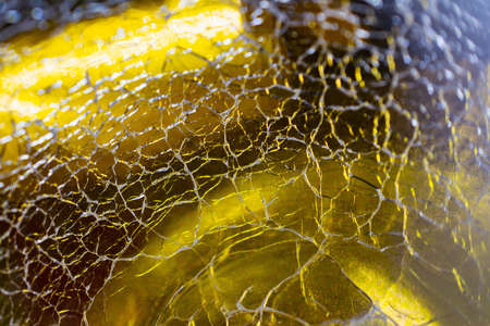 Background with a cracked glass texture of gold color. Concept background, textureの写真素材