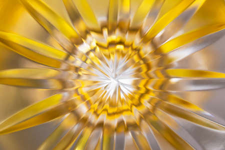 Abstract blurred background in the form of a flower and sun rays of gold color. Concept background, textureの写真素材