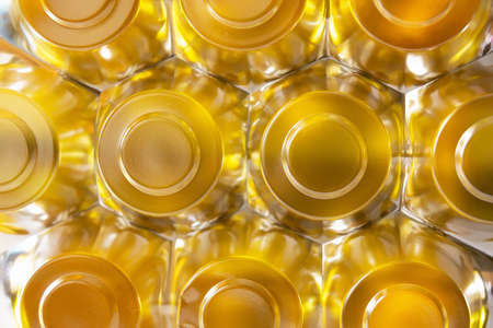 Abstract background in the form of hexagons and circles in gold color with a luminous surface. Concept background, textureの写真素材