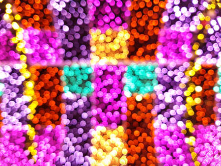 Bright background from blurry bokeh of Christmas lights of different colors. Holiday concept, background, christmasの写真素材