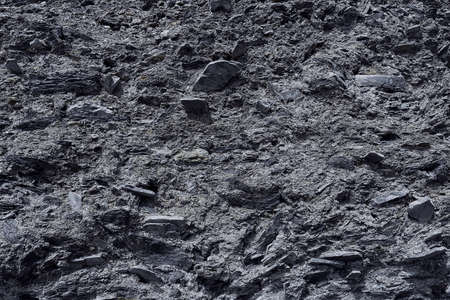 The texture of the stone surface of the mountain with minerals in monochrome colors of black and gray. Concept background, texture.の写真素材