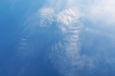 Blue sky with white clouds that form the wings of an angel. Concept landscape, abstractionの写真素材