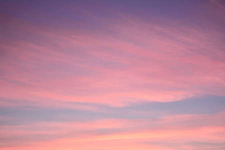 Blue sky at sunset with bright stains of orange and pink. Concept landscape, abstraction.の写真素材