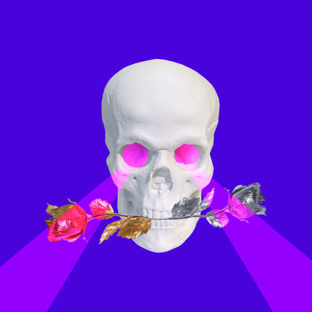 Contemporary collage. White skull with roses in teeth and a pink laser from the eyes on a blue background.の写真素材