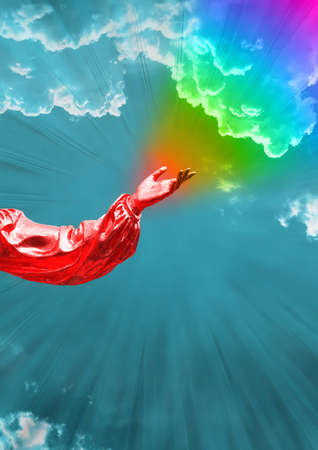 Contemporary collage. A hand of red color against a background of a dark blue sky with clouds from which a rainbow flies.の写真素材