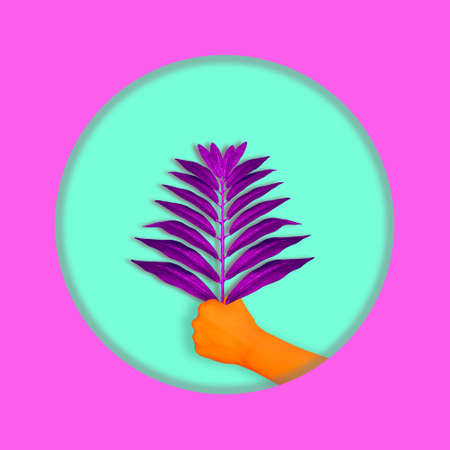 Contemporary collage. The hand of an orange man holds a branch of a palm tree. Holiday concept, artの写真素材
