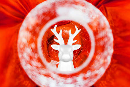 Abstract background with a glowing glass ball with a cracked surface on a golden fabric. Selective focus. Concept abstraction, background.の写真素材