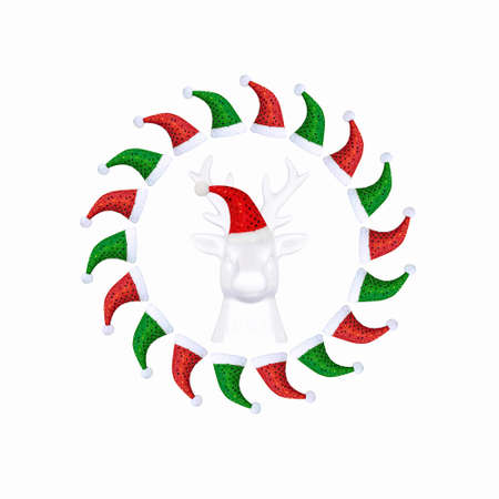 Contemporary collage. 3D illustration. Christmas background with a white deer in a red cap on a white backgroundの写真素材