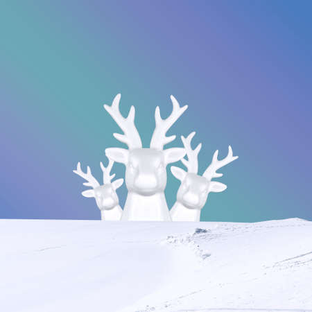 Contemporary collage. 3D illustration. Christmas background with a family of white deer on the snow on a blue backgroundの写真素材