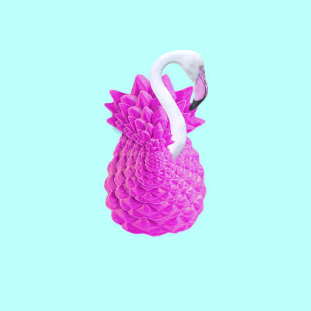 Contemporary collage. 3D illustration. White flamingo in pink pineapple on a blue backgroundの写真素材