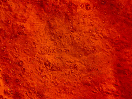 Abstract orange background of water and sand with round streaks on the surfaceの写真素材