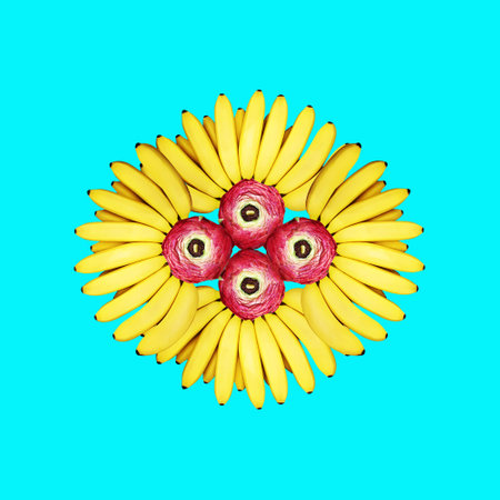 Contemporary collage. Magic eye made of yellow bananas and flowers on a blue background. Concept abstraction, artの写真素材