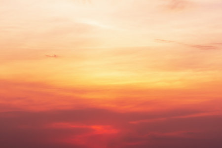A view of the sky at sunset in vibrant orange pinks and violet colors.の写真素材