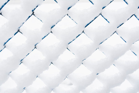 View of the snow-covered mesh netting. Background concept, nature.の写真素材