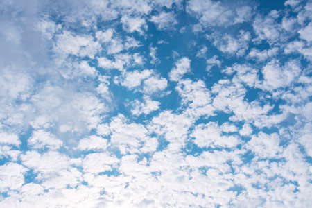 View of the blue sky with white cumulus cloudsの写真素材