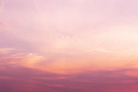 A view of the sky at sunset in vibrant orange pinks and violet colorsの写真素材