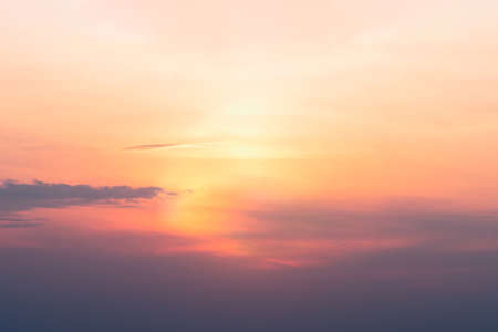 A view of the sky at sunset in vibrant orange pinks and violet colorsの写真素材