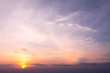 A view of the sky at sunset in vibrant orange pinks and violet colorsの写真素材