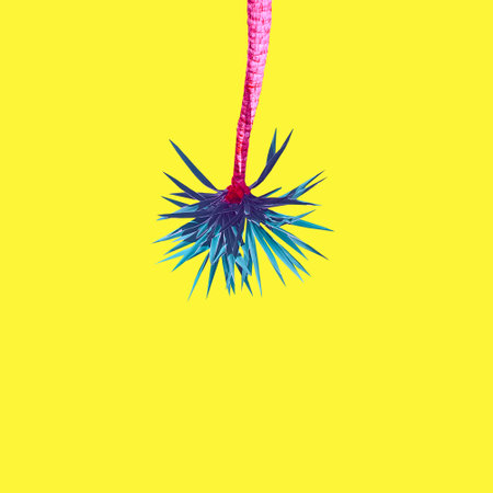 Abstract pink-turquoise palms on an yellow backgroundの写真素材