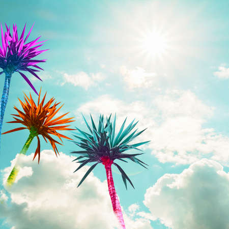 Abstract bright multicolored palms on a background of blue sky with cloudsの写真素材