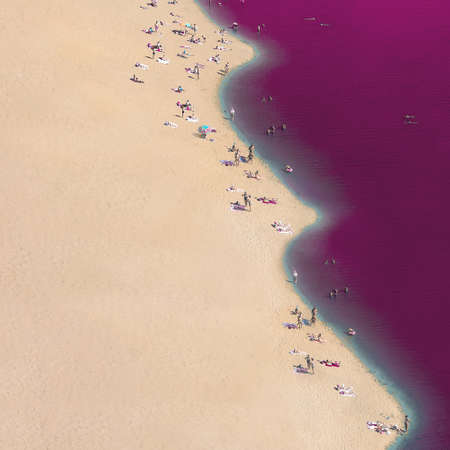 Abstract view of the beach with people and pink seaの写真素材
