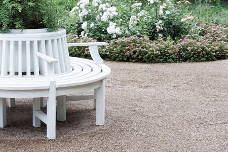Landscaping of the local area with white benches, gravel paths and flower beds.の写真素材