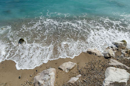 Waves on sand near beach