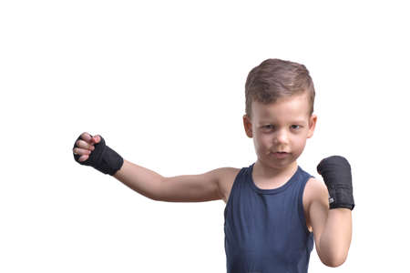 Little boy boxing, shows his fists, isolated on whiteの写真素材