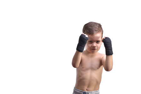 Little boy boxing, shows his fists, isolated on whiteの写真素材
