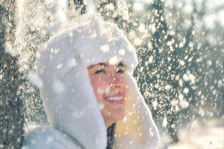 Portrait of a happy teenage girl in the snow