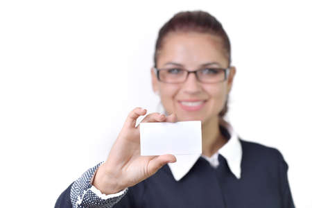 A beautiful woman holds out a business or credit card Isolated on white backgroundの写真素材