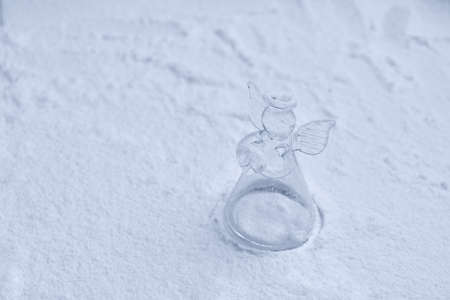 Crystal angel Christmas decoration in the snowの写真素材