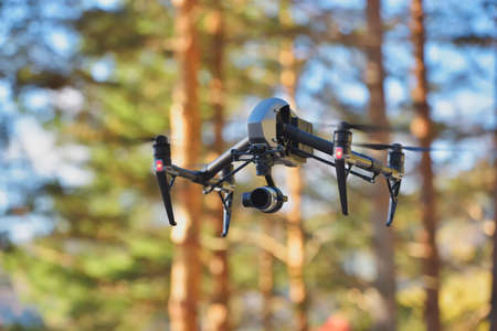 Flying drone on natural background