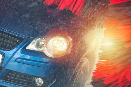 Automatic car wash in action. Car wash concept. Automated technologyの写真素材