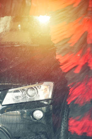 Automatic car wash in action. Car wash concept. Automated technologyの写真素材