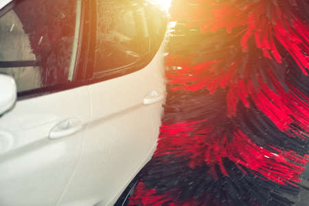 Automatic car wash in action. Car wash concept. Automated technologyの写真素材