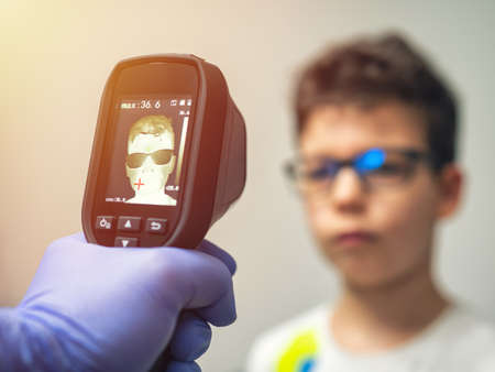 A thermal scanner for Fever And Symptoms of Coronavirus at College, School, Office, Mall or Hospital